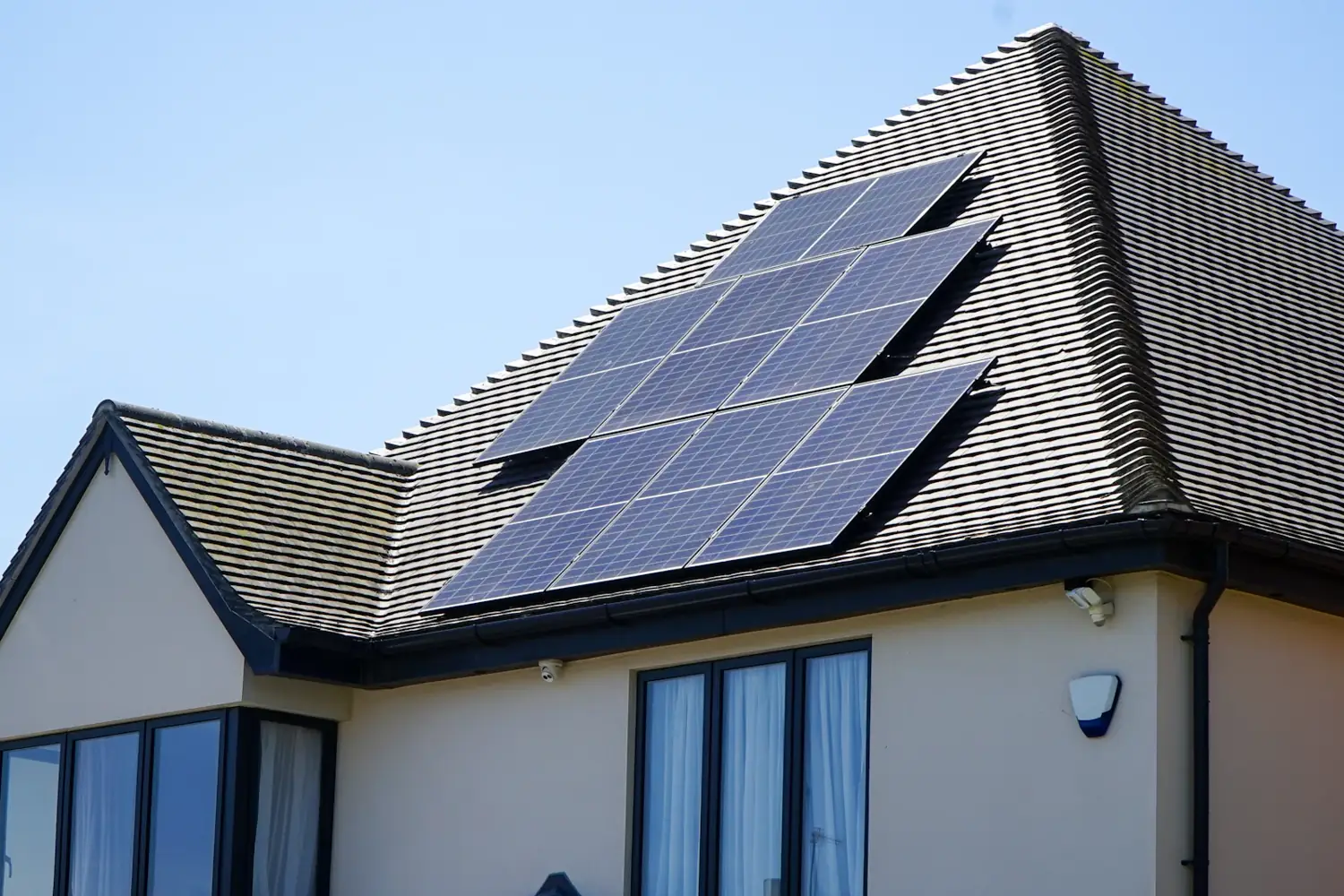 Home with a rooftop solar system on a sunny day