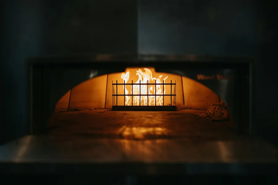 Logs burning inside the oven