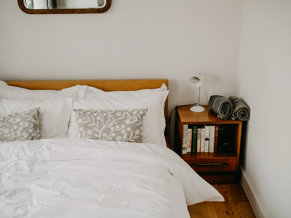 Bedroom with freshly made white bed
