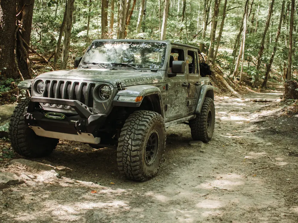 Lifted 4WD on mud-terrain tyres on a dirt track