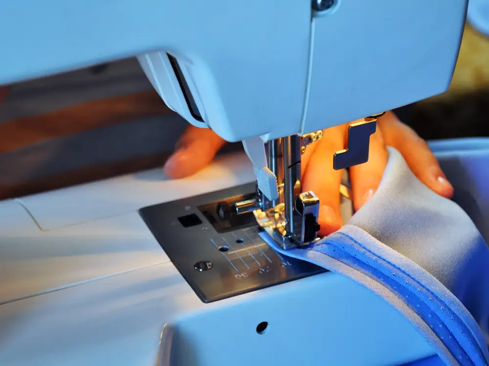 Hem being stitched on a sewing machine