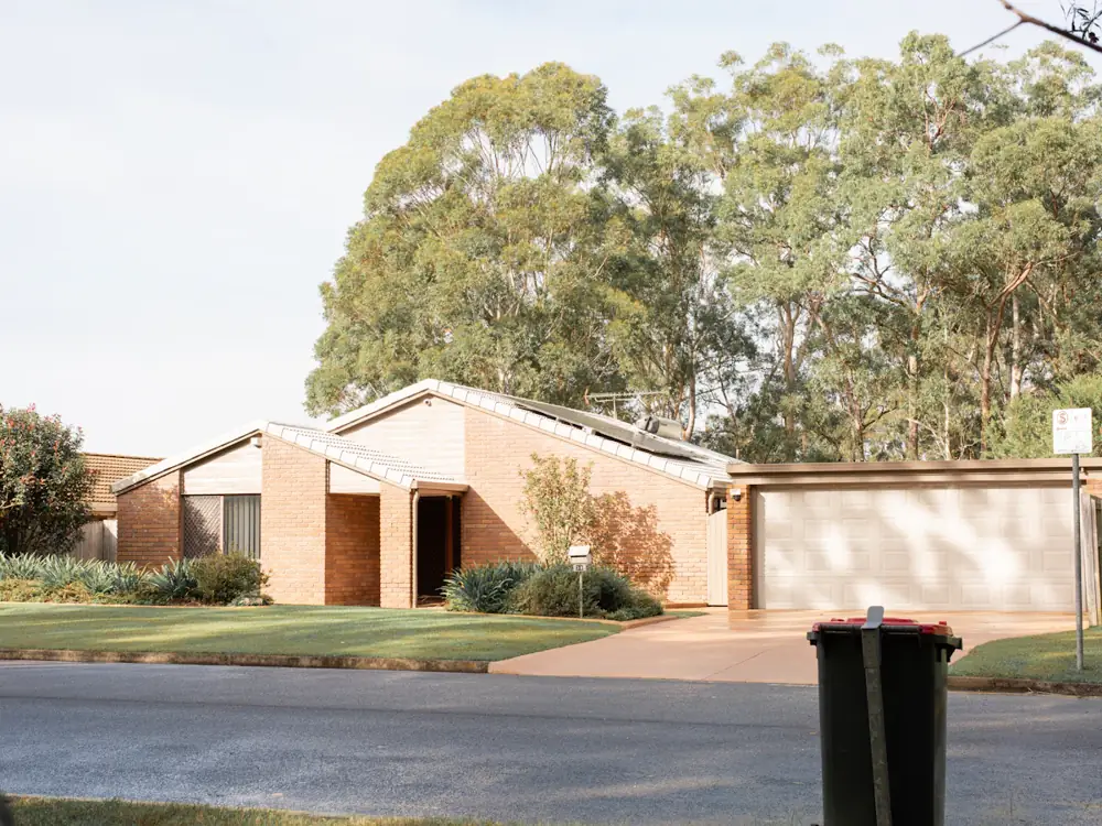 Brick family home with a double garage and gardens