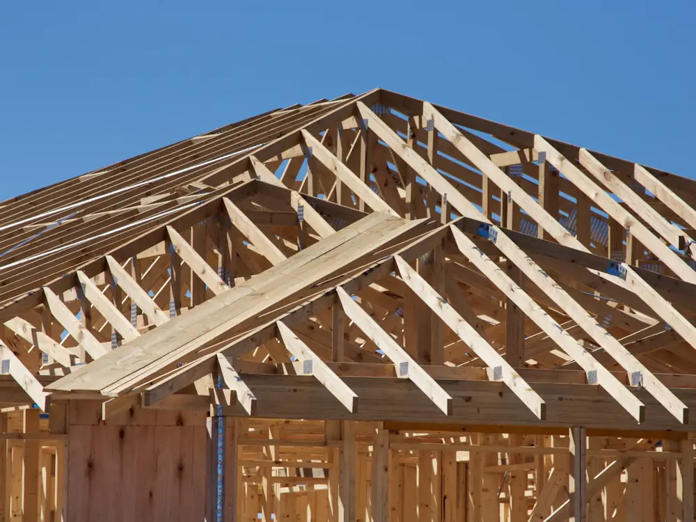 Timber roof trusses and wall frames at frame stage