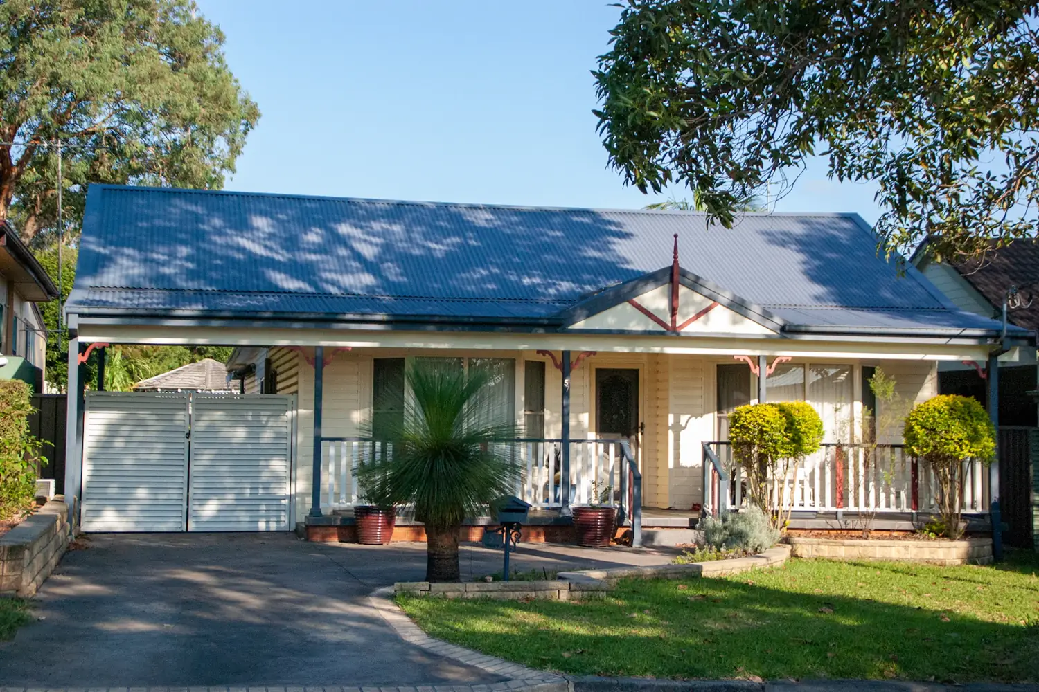 Single storey weatherboard home with verandah