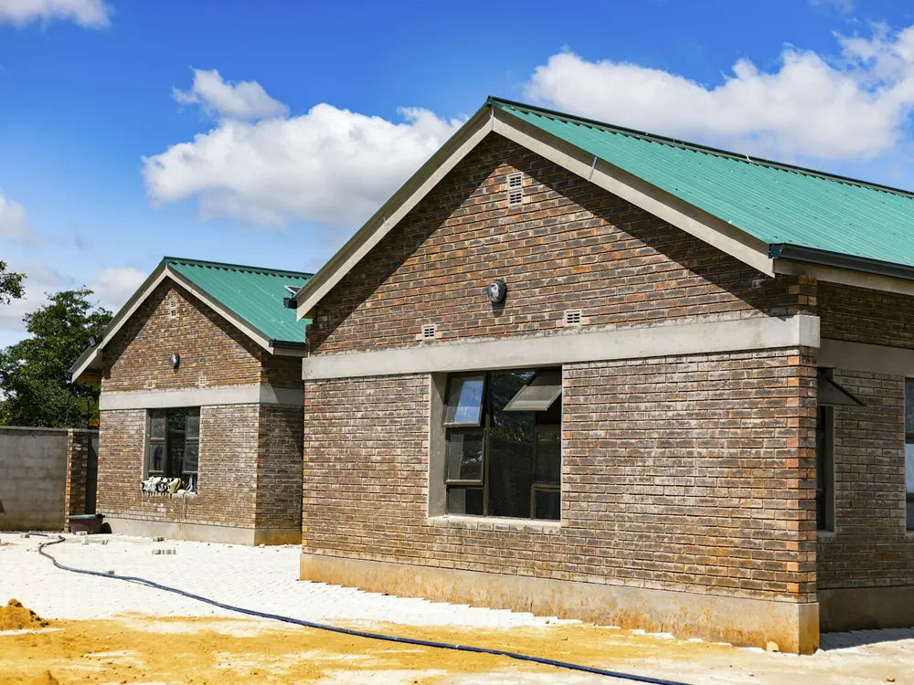 Brick home on a cleared site before a renovation