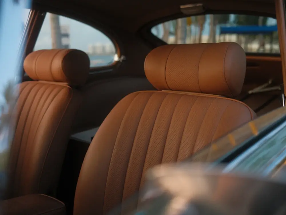 Clean tan leather front seats inside a car