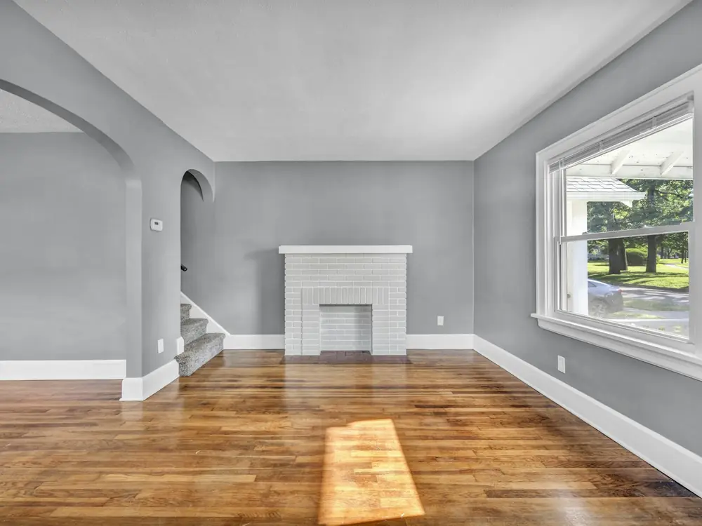 Empty room with freshly sanded honey-coloured timber floorboards