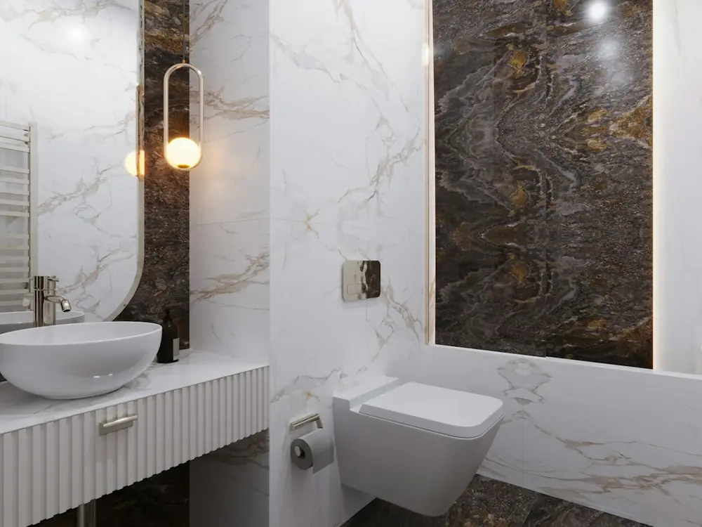 Ensuite with white Carrara marble walls, a dark book-matched stone feature wall and a vessel basin
