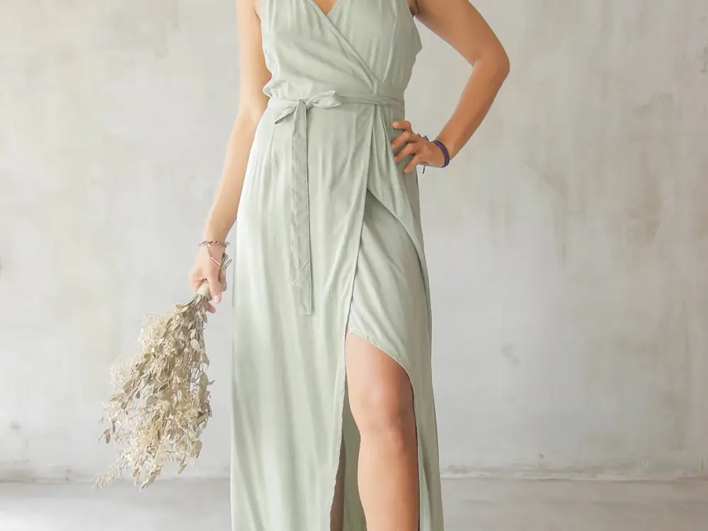 A sage green wrap dress with a tie waist