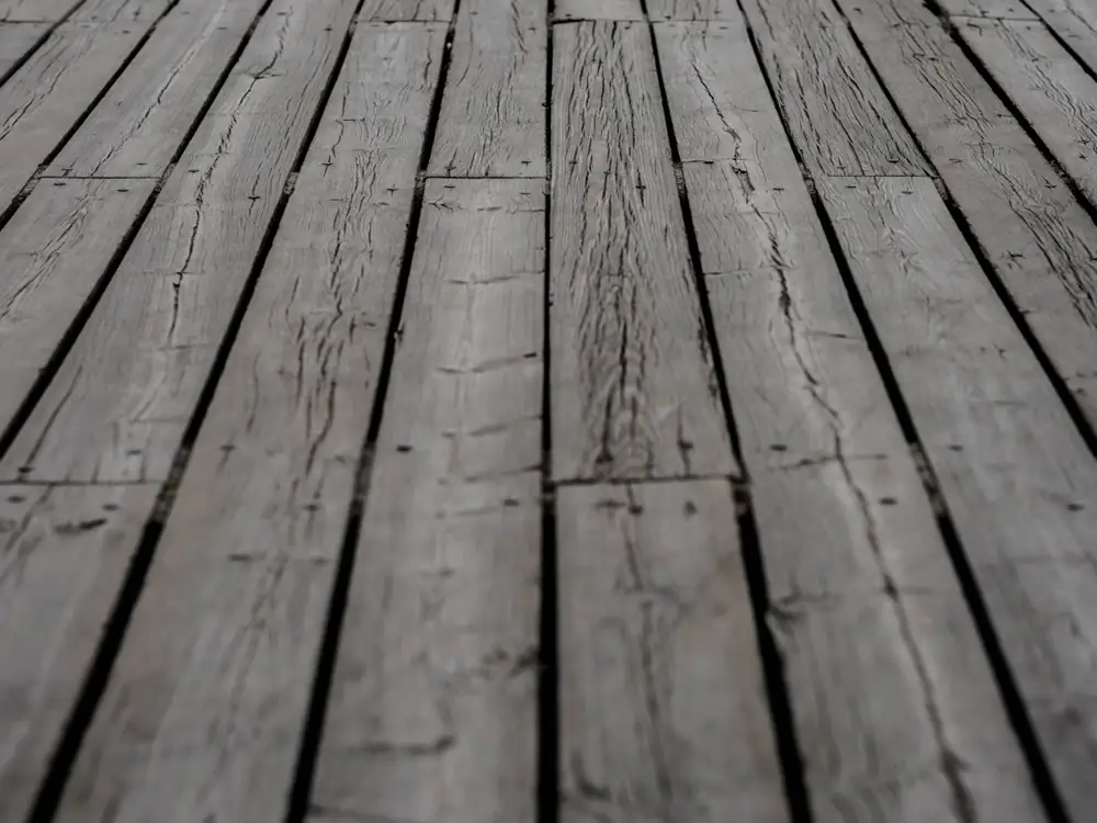 Before: grey, weathered and split deck boards
