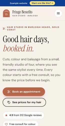 Fringe Benefits Hair Studio example website on a phone